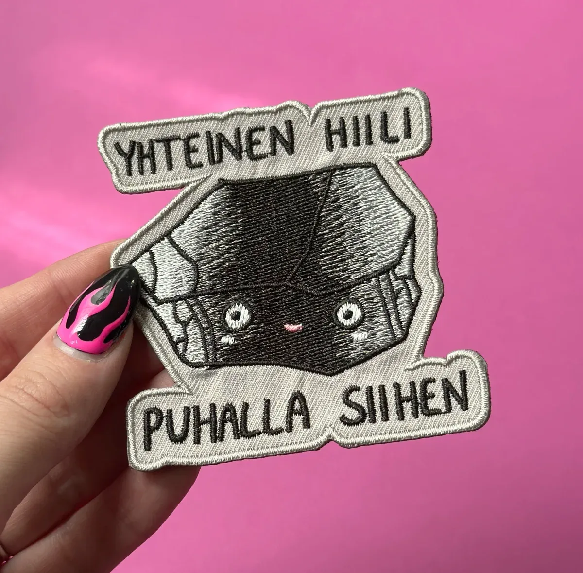 Yhteinen hiili, puhalla siihen – Kangasmerkki